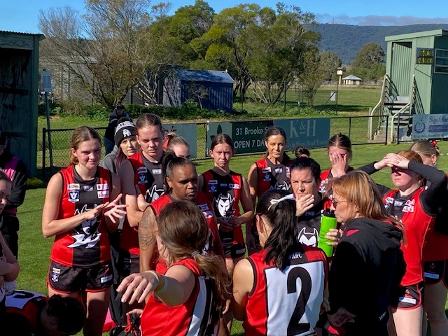 Team huddle encouraging positive culture